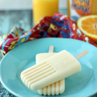 Creamy and cool, 2 Ingredient Orange Popsicles are so simple to make. You'll be enjoying this sweet, frozen treat in no time at all!